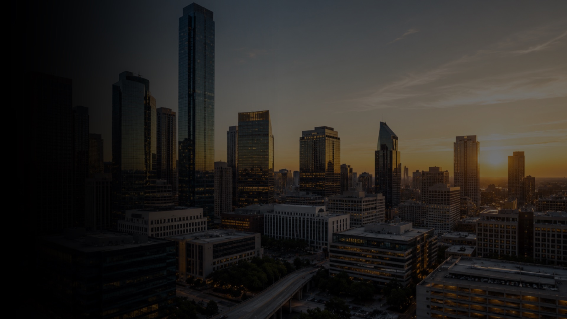 Downtown skyline of institutional commercial real estate at sunset